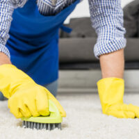 man cleaning carpet